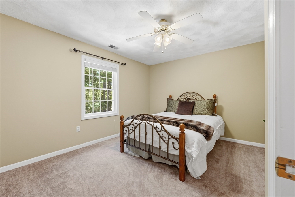 25 Haymeadow Road Boxford, MA 01921 - Photo 27 of 42 a bedroom with a bed and a window