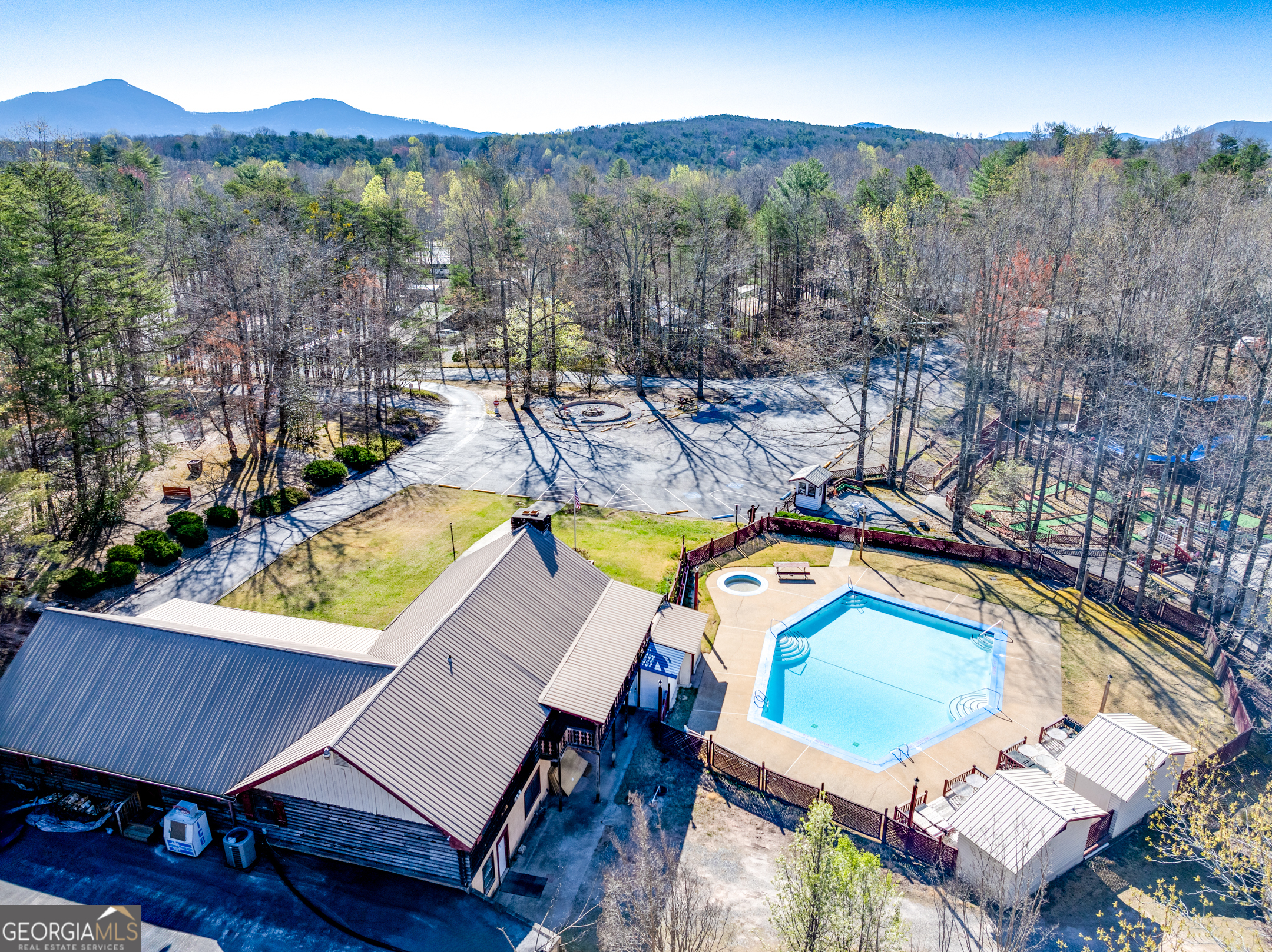 4 Evergreen Trail, Unit B22 Cleveland, GA 30528 - Photo 16 of 33 a view of a swimming pool with a lounge chairs