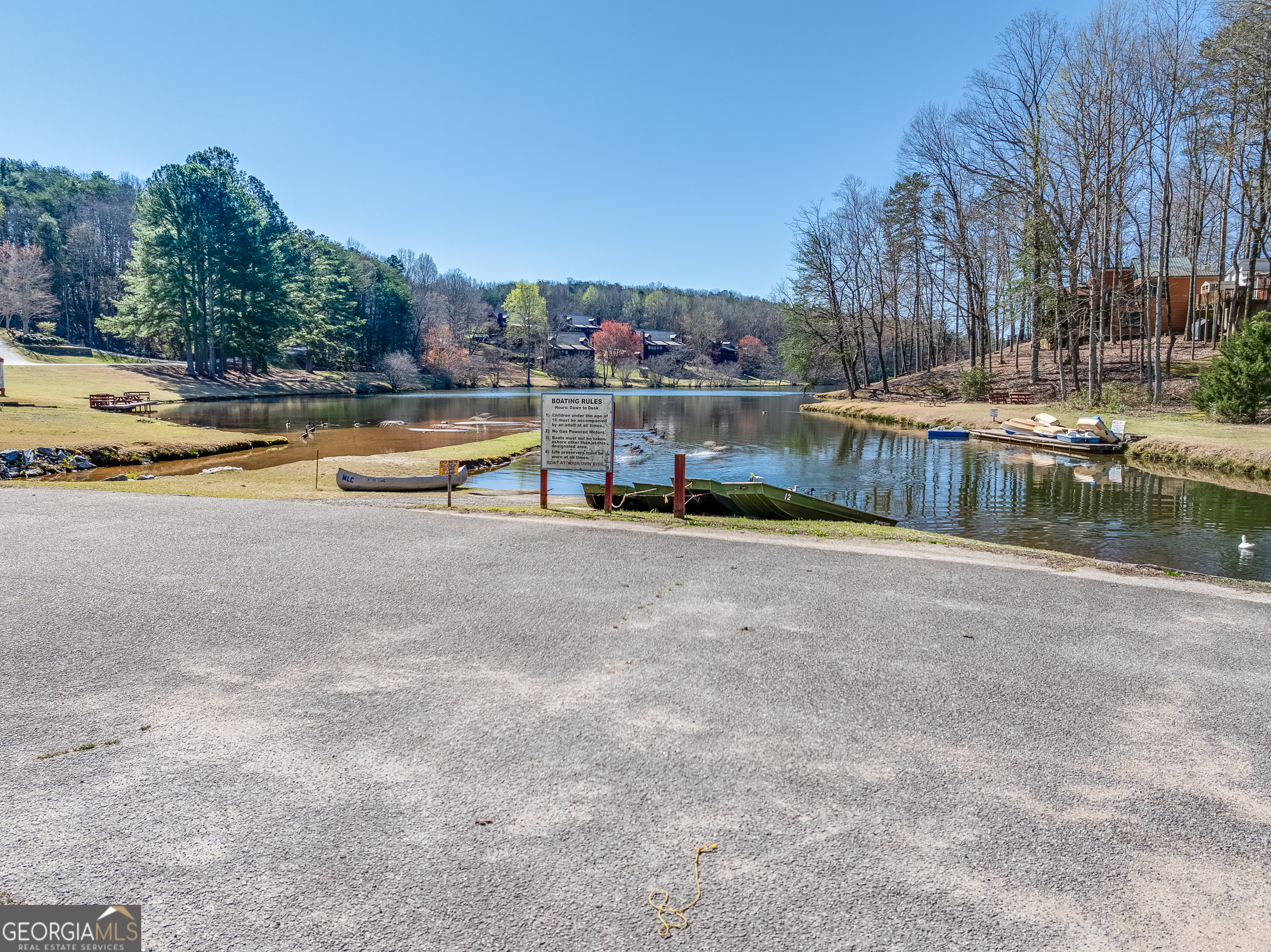 4 Evergreen Trail, Unit B22 Cleveland, GA 30528 - Photo 29 of 33 a view of a swimming pool with a lounge chair