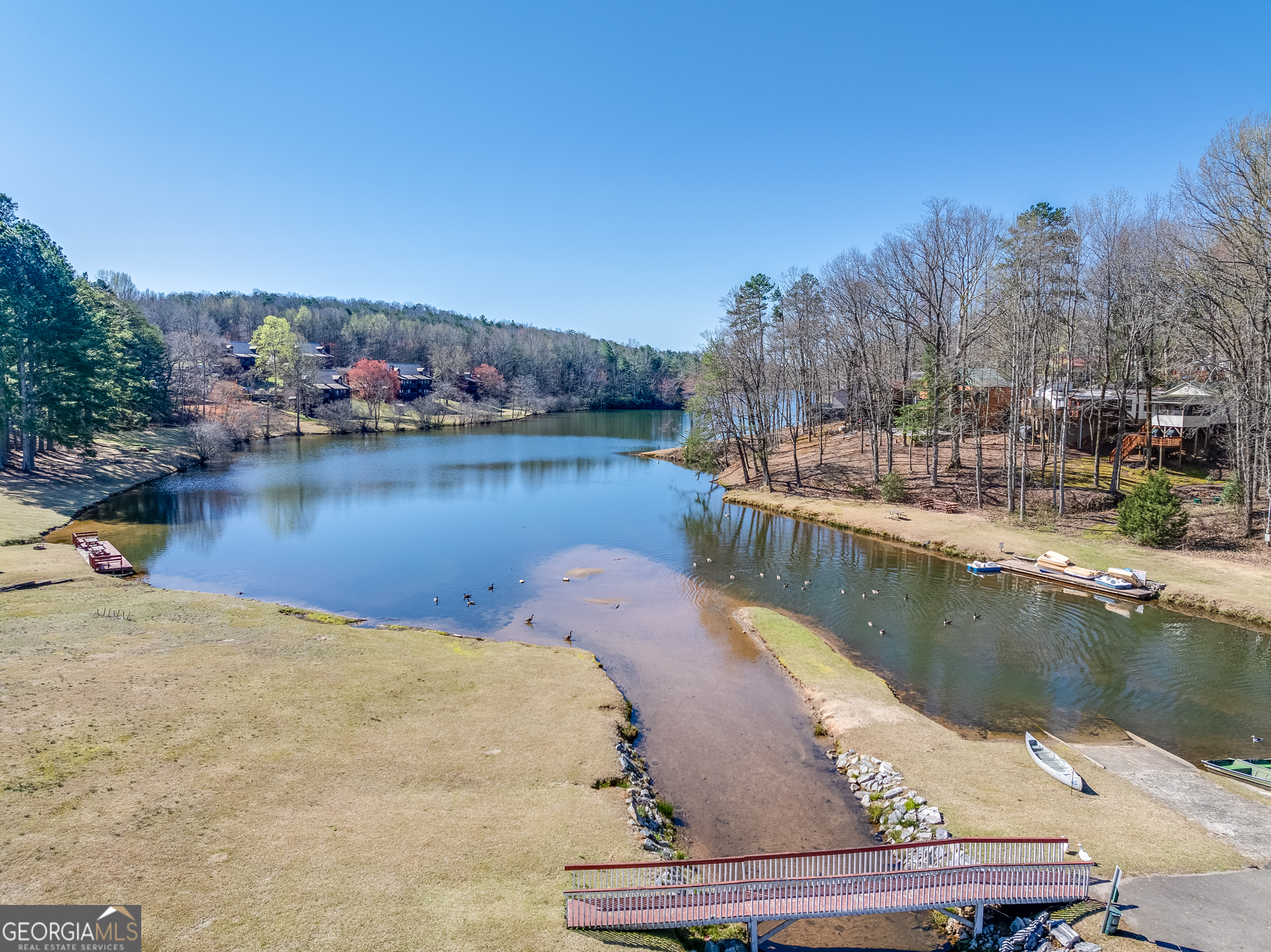 4 Evergreen Trail, Unit B22 Cleveland, GA 30528 - Photo 30 of 33 a view of a lake with boats and trees in the background