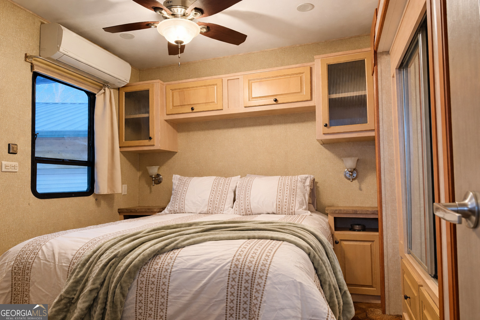 4 Evergreen Trail, Unit B22 Cleveland, GA 30528 - Photo 7 of 33 a bedroom with a large bed and ceiling fan