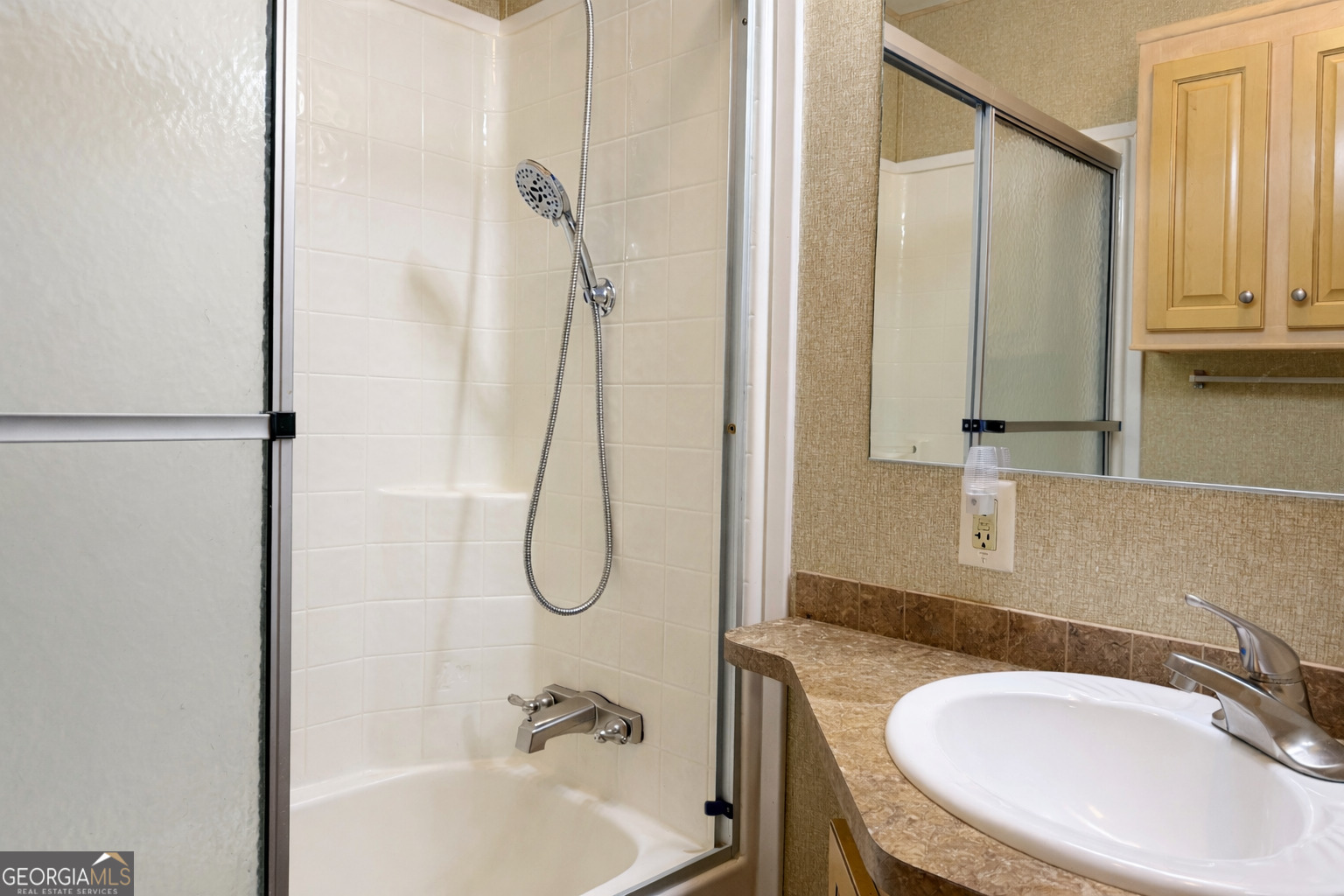4 Evergreen Trail, Unit B22 Cleveland, GA 30528 - Photo 9 of 33 a bathroom with a sink vanity mirror and tub