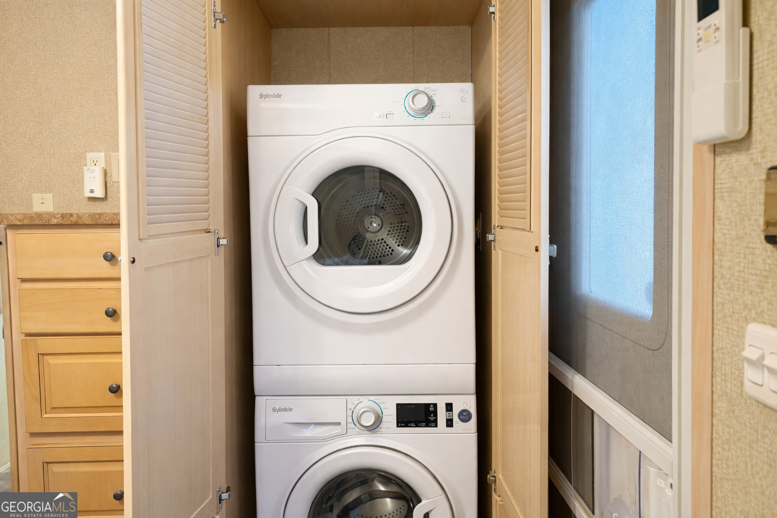 4 Evergreen Trail, Unit B22 Cleveland, GA 30528 - Photo 10 of 33 a close view of a utility room with dryer and washer