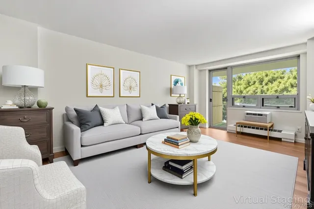 a view of a room with a table and chairs