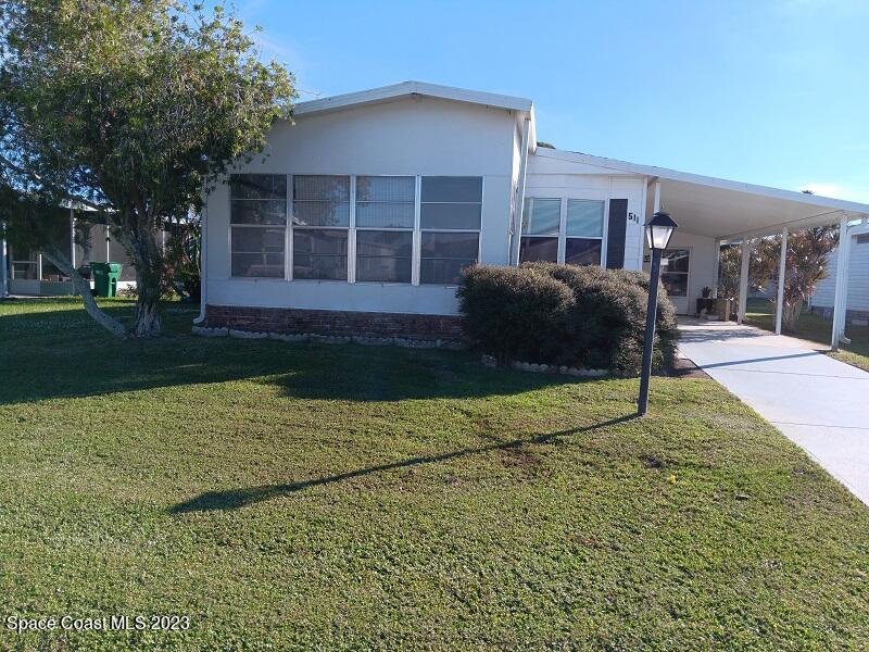 a house view with a backyard space