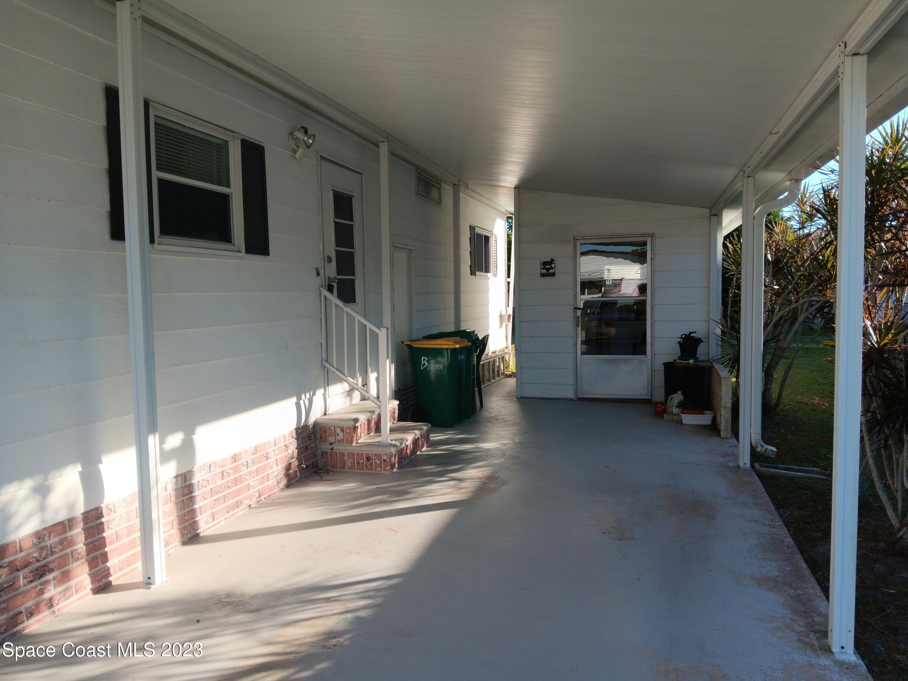 511 Puffin Drive Barefoot Bay, FL 32976 - Photo 5 of 25 a view of a living room