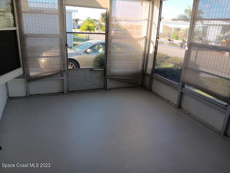 511 Puffin Drive Barefoot Bay, FL 32976 - Photo 6 of 25 a view of a room with window