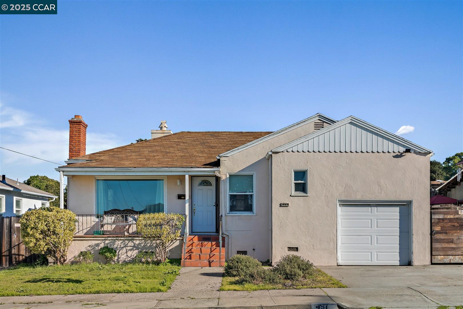 451 Vallejo Avenue Rodeo, CA 94572 - Photo 1 of 1 a front view of a house with a yard