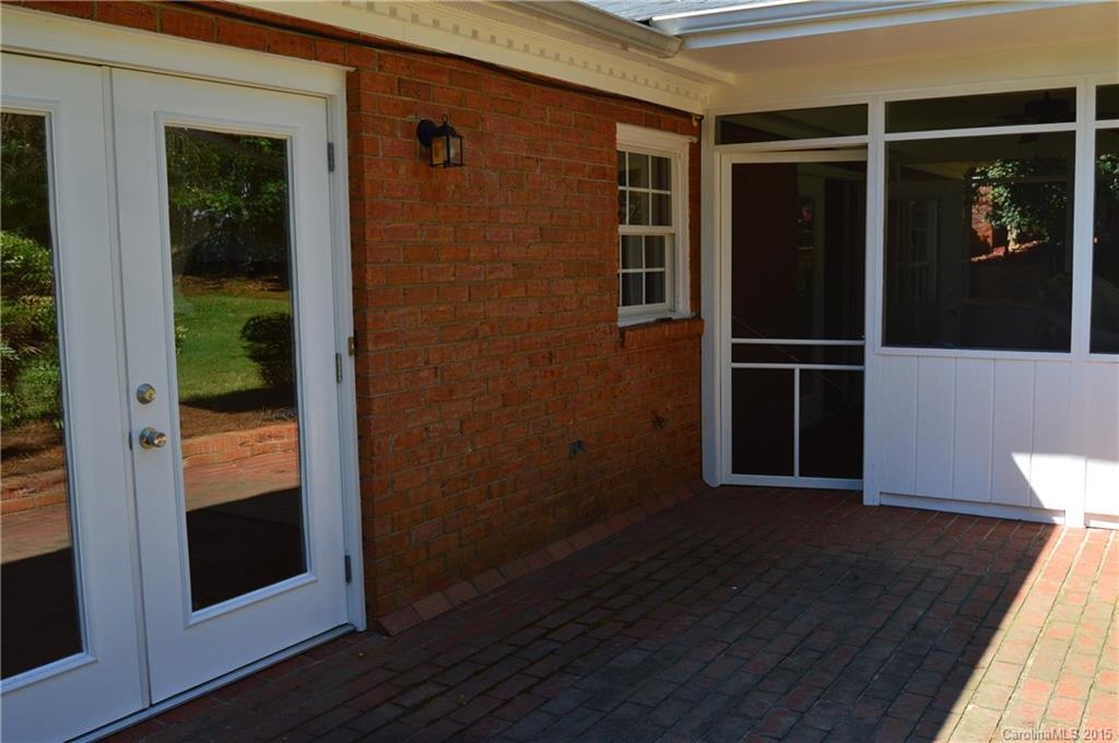 217 Museum Road Statesville, NC 28625 - Photo 13 of 19 a view of a porch with wooden floor and a floor to ceiling window