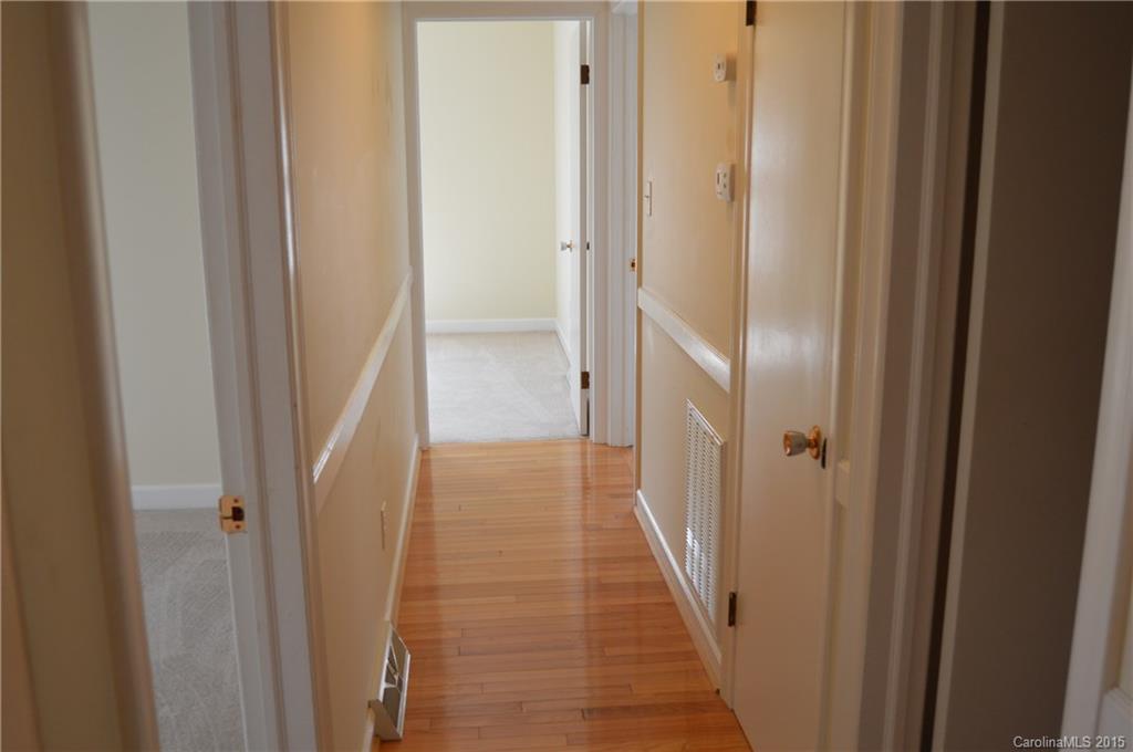 217 Museum Road Statesville, NC 28625 - Photo 14 of 19 a view of a hallway with wooden floor