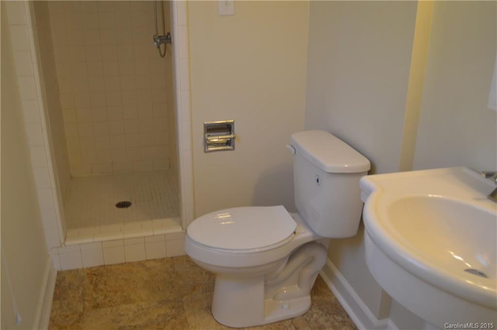 217 Museum Road Statesville, NC 28625 - Photo 18 of 19 a bathroom with a toilet and shower