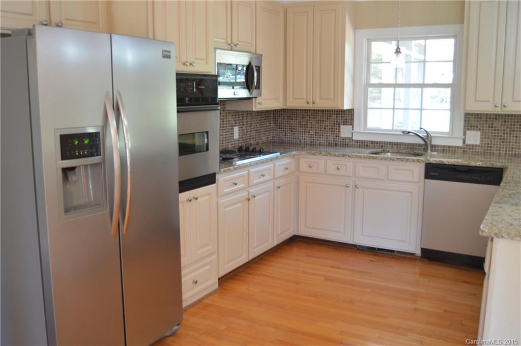 217 Museum Road Statesville, NC 28625 - Photo 8 of 19 a kitchen with stainless steel appliances a refrigerator sink and microwave