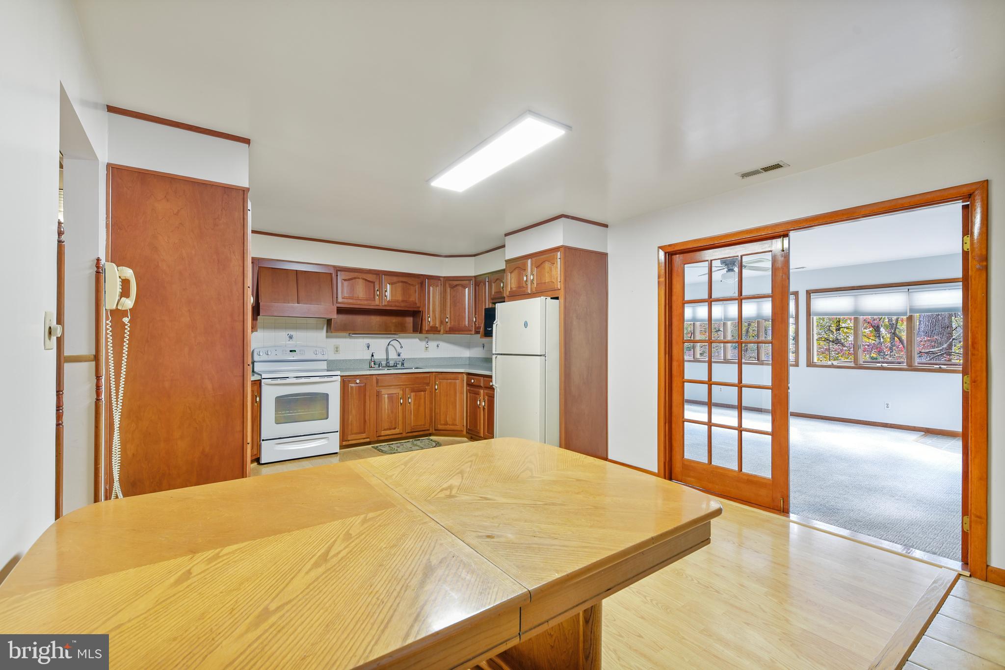 455 Community Road Severna Park, MD 21146 - Photo 18 of 51 a bedroom with a large bed and wooden floor
