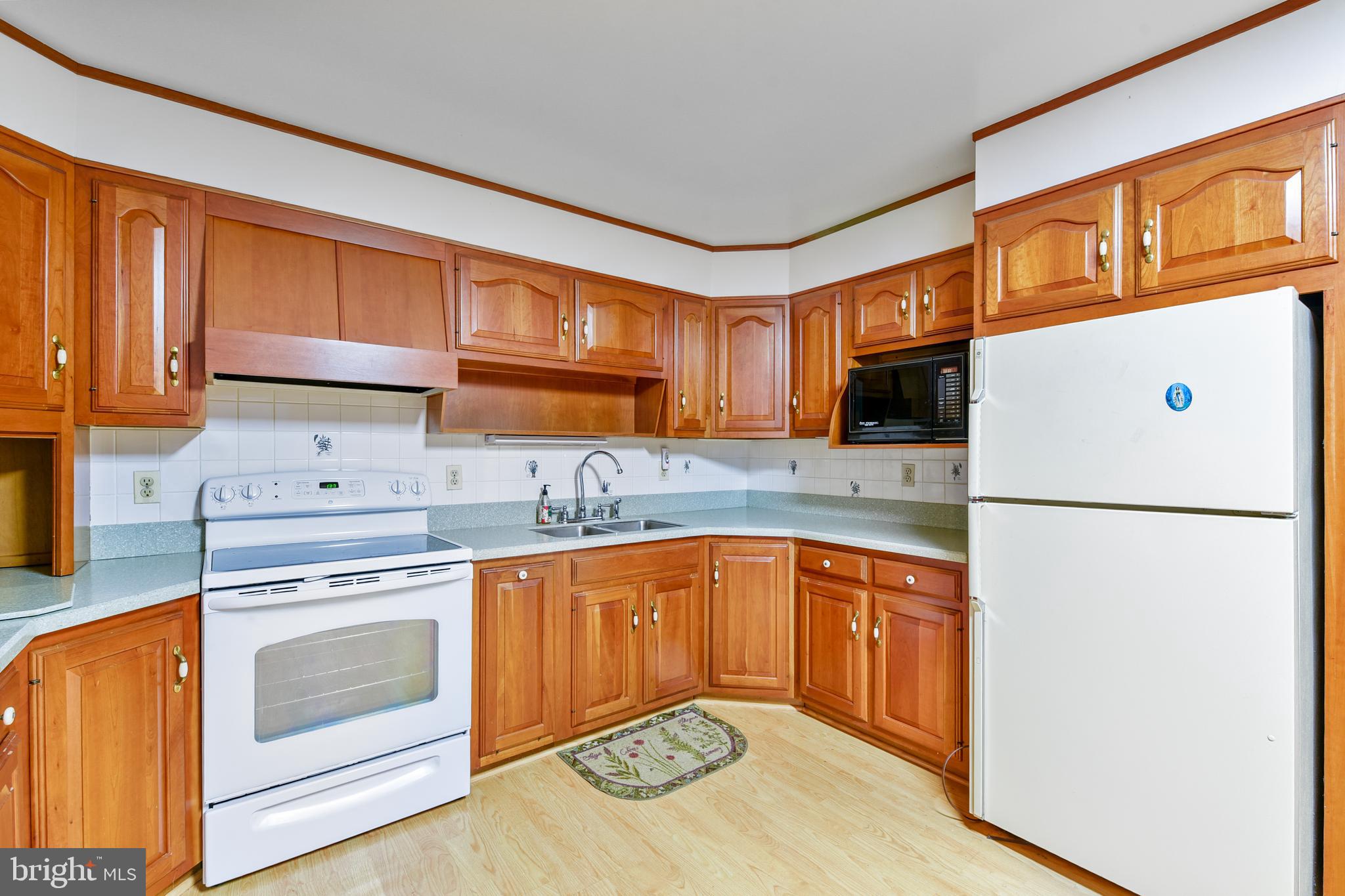 455 Community Road Severna Park, MD 21146 - Photo 19 of 51 a kitchen with stainless steel appliances granite countertop a refrigerator sink stove and oven