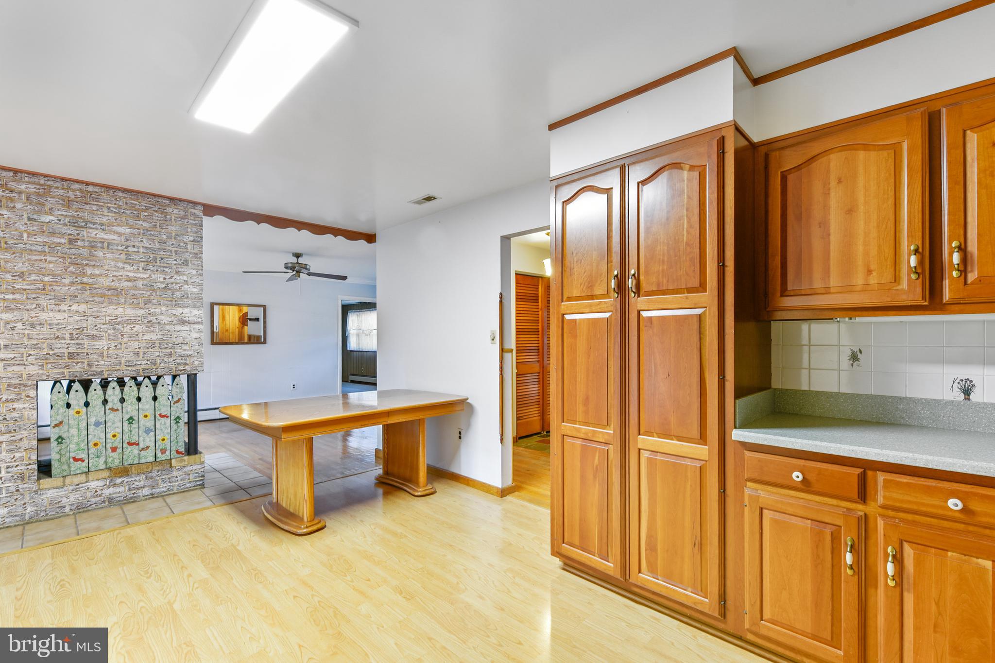 455 Community Road Severna Park, MD 21146 - Photo 20 of 51 a view of a kitchen with furniture and refrigerator in a kitchen