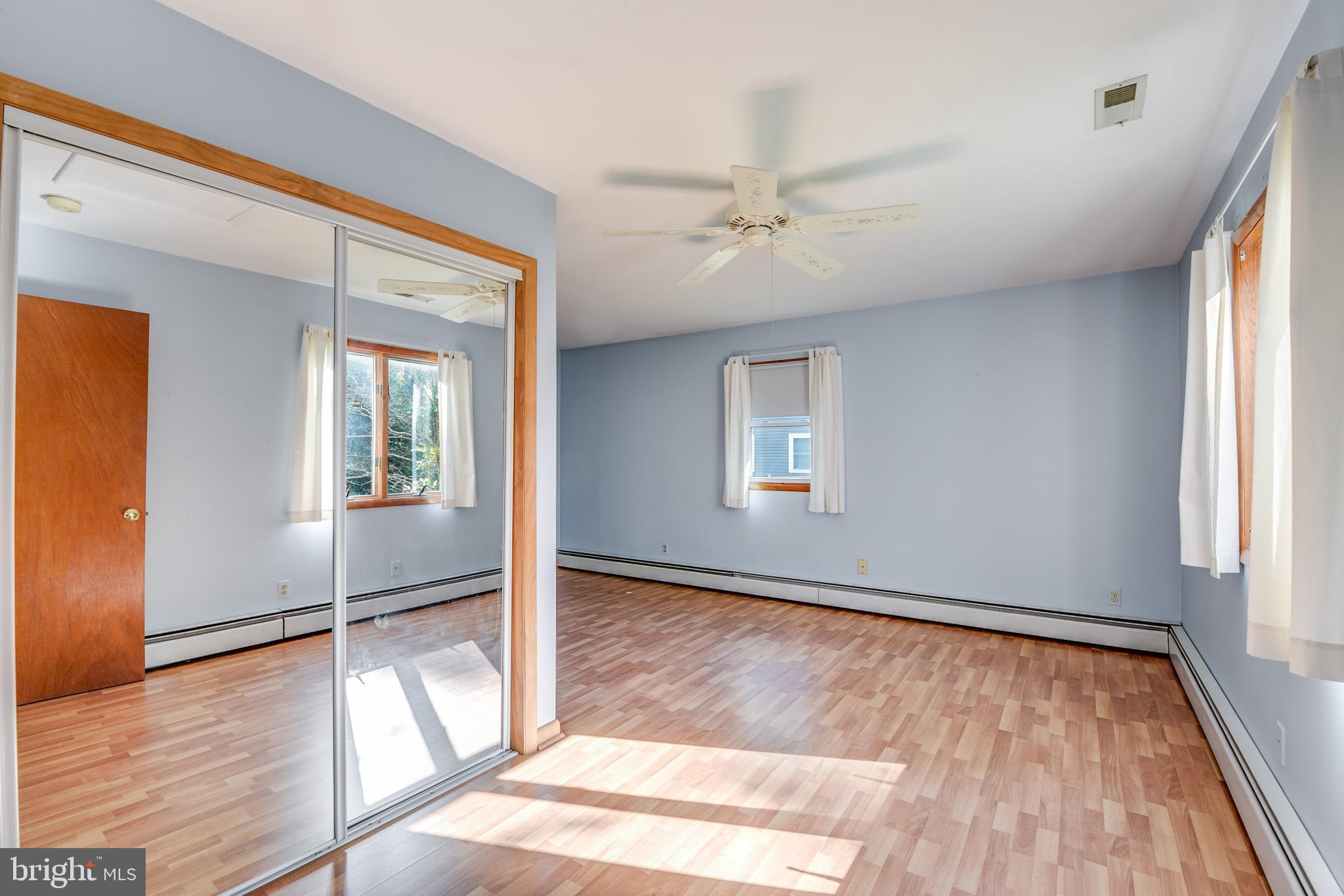 455 Community Road Severna Park, MD 21146 - Photo 24 of 51 wooden floor in an empty room with a window
