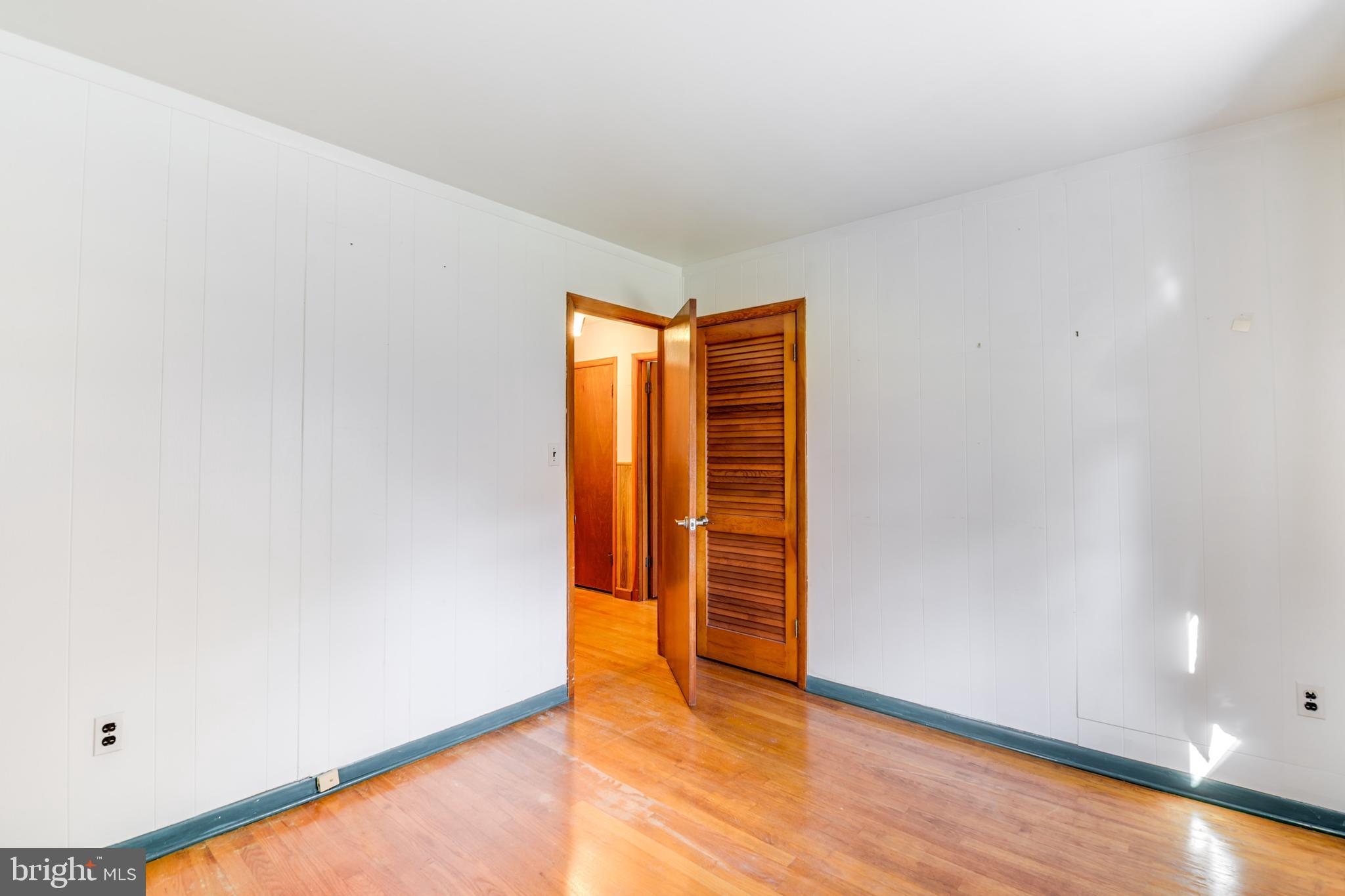 455 Community Road Severna Park, MD 21146 - Photo 31 of 51 a view of empty room with wooden floor