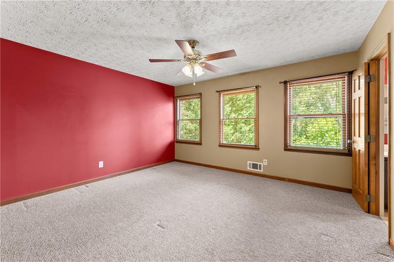 735 Calhoun Road Dahlonega, GA 30533 - Photo 13 of 53 an empty room with windows and ceiling fan view