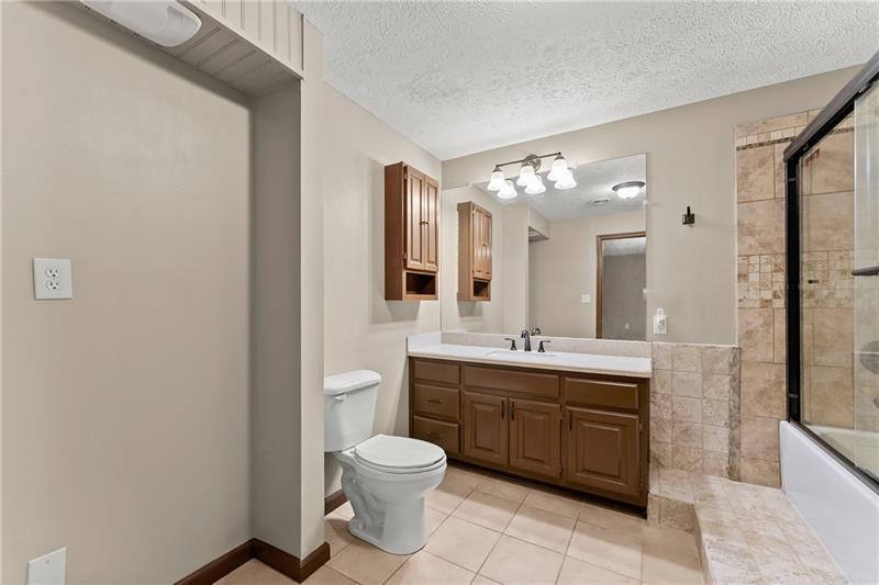 735 Calhoun Road Dahlonega, GA 30533 - Photo 29 of 53 a spacious bathroom with a toilet sink and mirror