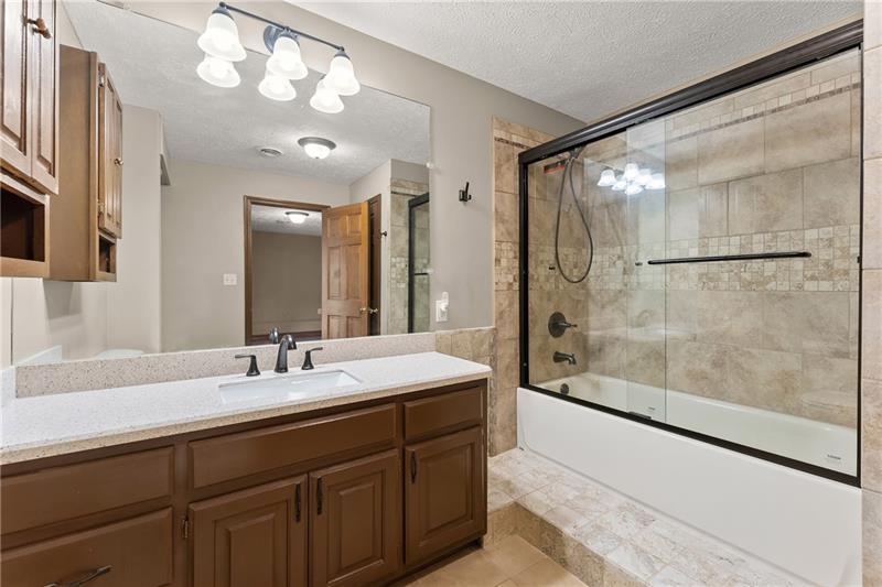 735 Calhoun Road Dahlonega, GA 30533 - Photo 30 of 53 a bathroom with a sink mirror and a shower