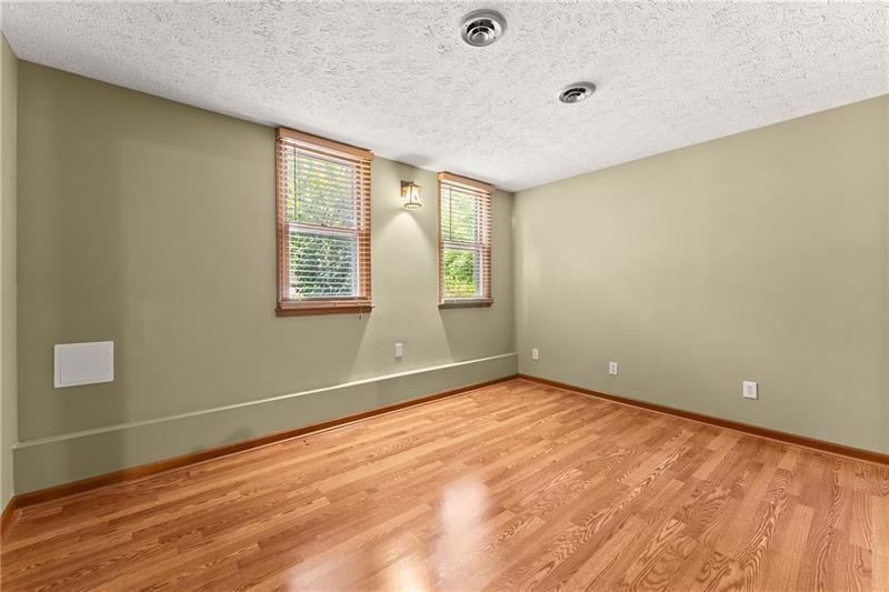 735 Calhoun Road Dahlonega, GA 30533 - Photo 31 of 53 a view of an empty room with wooden floor and a window