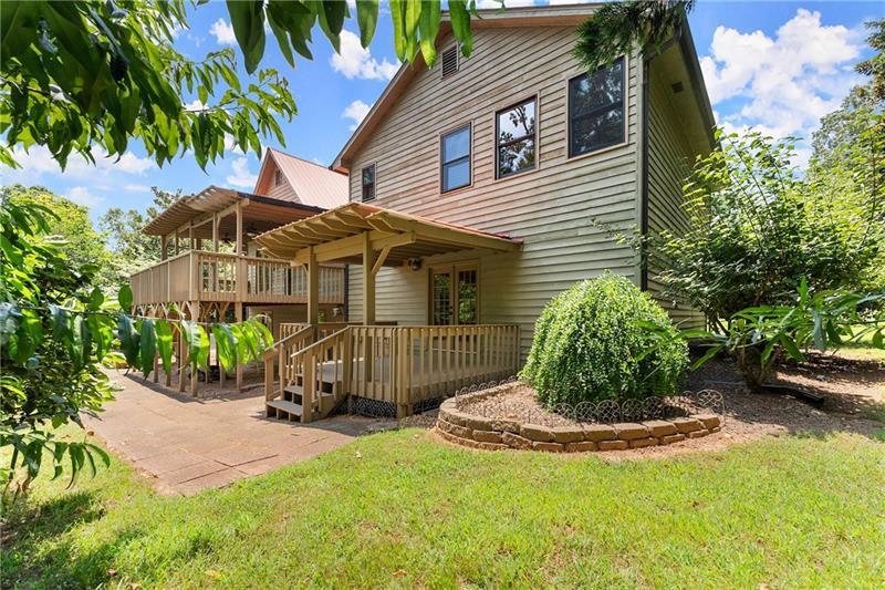 735 Calhoun Road Dahlonega, GA 30533 - Photo 40 of 53 a front view of a house with a garden