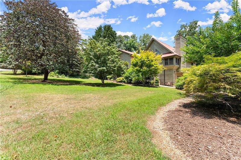 735 Calhoun Road Dahlonega, GA 30533 - Photo 45 of 53 a front view of a house with a yard