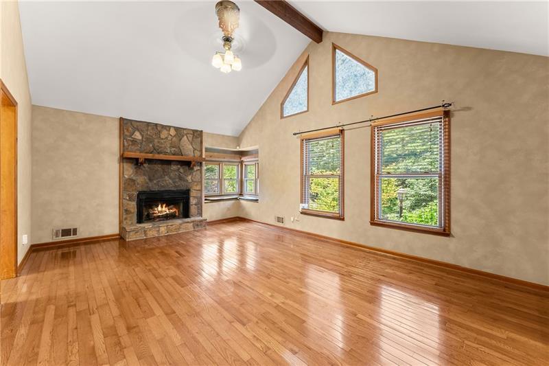 735 Calhoun Road Dahlonega, GA 30533 - Photo 5 of 53 a view of empty room with fireplace and wooden floor