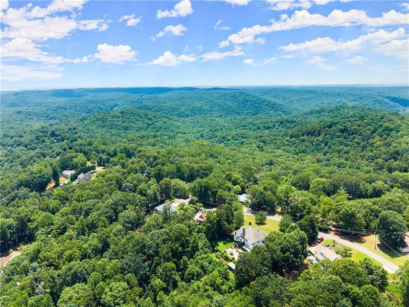 735 Calhoun Road Dahlonega, GA 30533 - Photo 53 of 53 an aerial view of residential houses with outdoor space and trees
