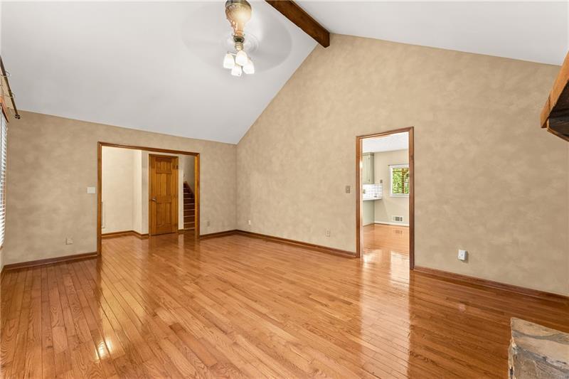 735 Calhoun Road Dahlonega, GA 30533 - Photo 6 of 53 a view of an empty room with wooden floor and a window