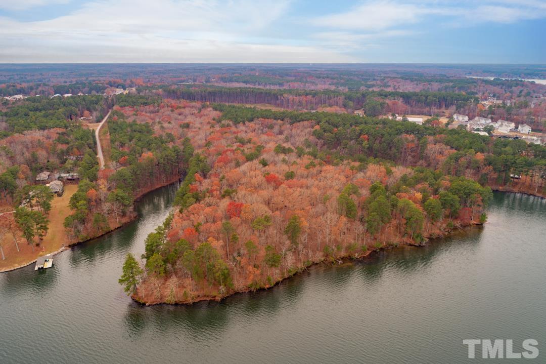 Lot 20 Serenity Point Littleton, NC 27850 - Photo 1 of 31 an aerial view of residential houses with outdoor space and lake view