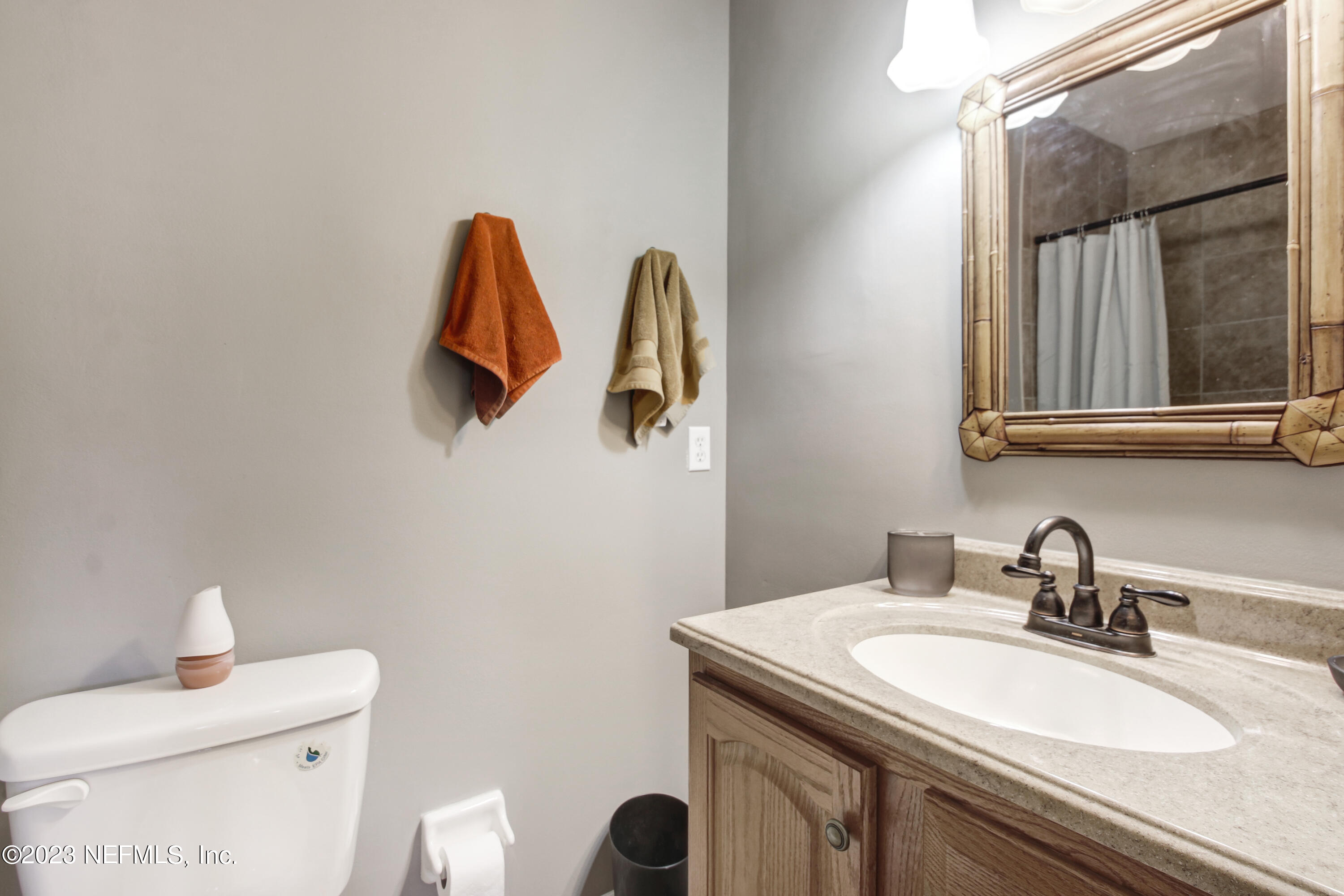 3801 Crown Point Road, Unit 3012 Jacksonville, FL 32257 - Photo 20 of 30 a bathroom with a toilet sink and mirror