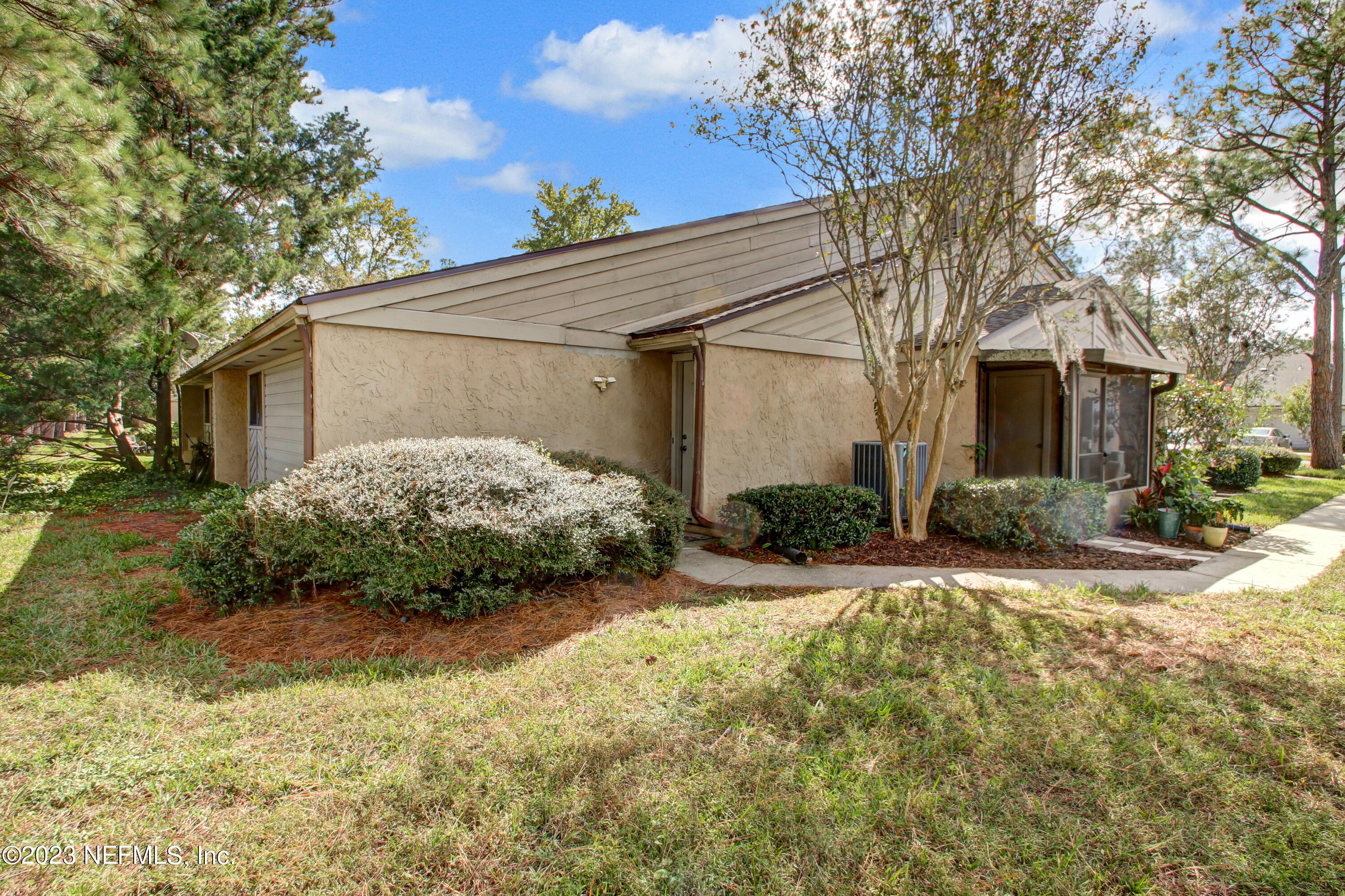3801 Crown Point Road, Unit 3012 Jacksonville, FL 32257 - Photo 2 of 30 a view of a house with a yard and large tree