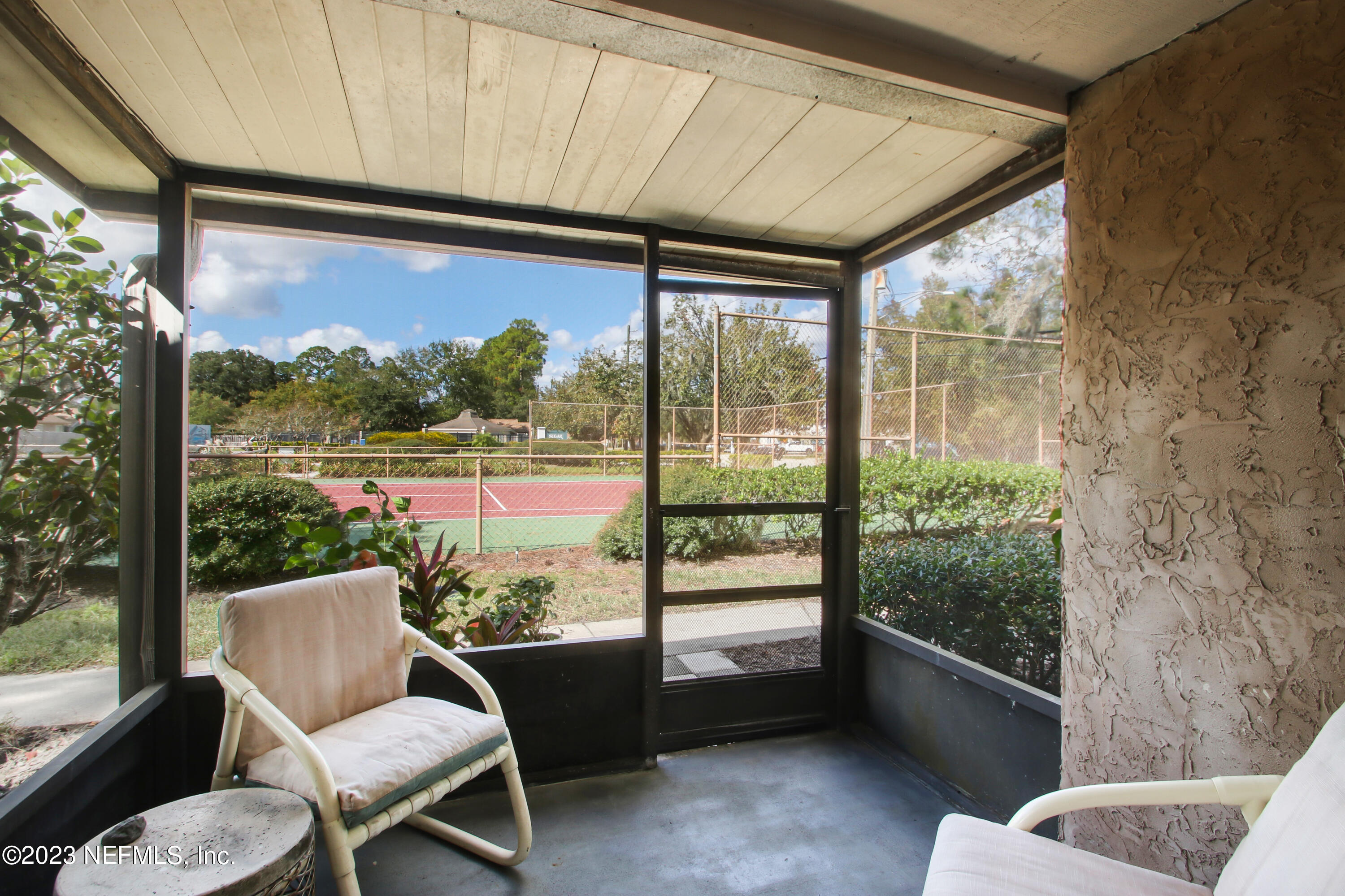 3801 Crown Point Road, Unit 3012 Jacksonville, FL 32257 - Photo 24 of 30 a view of a chair and table in the balcony