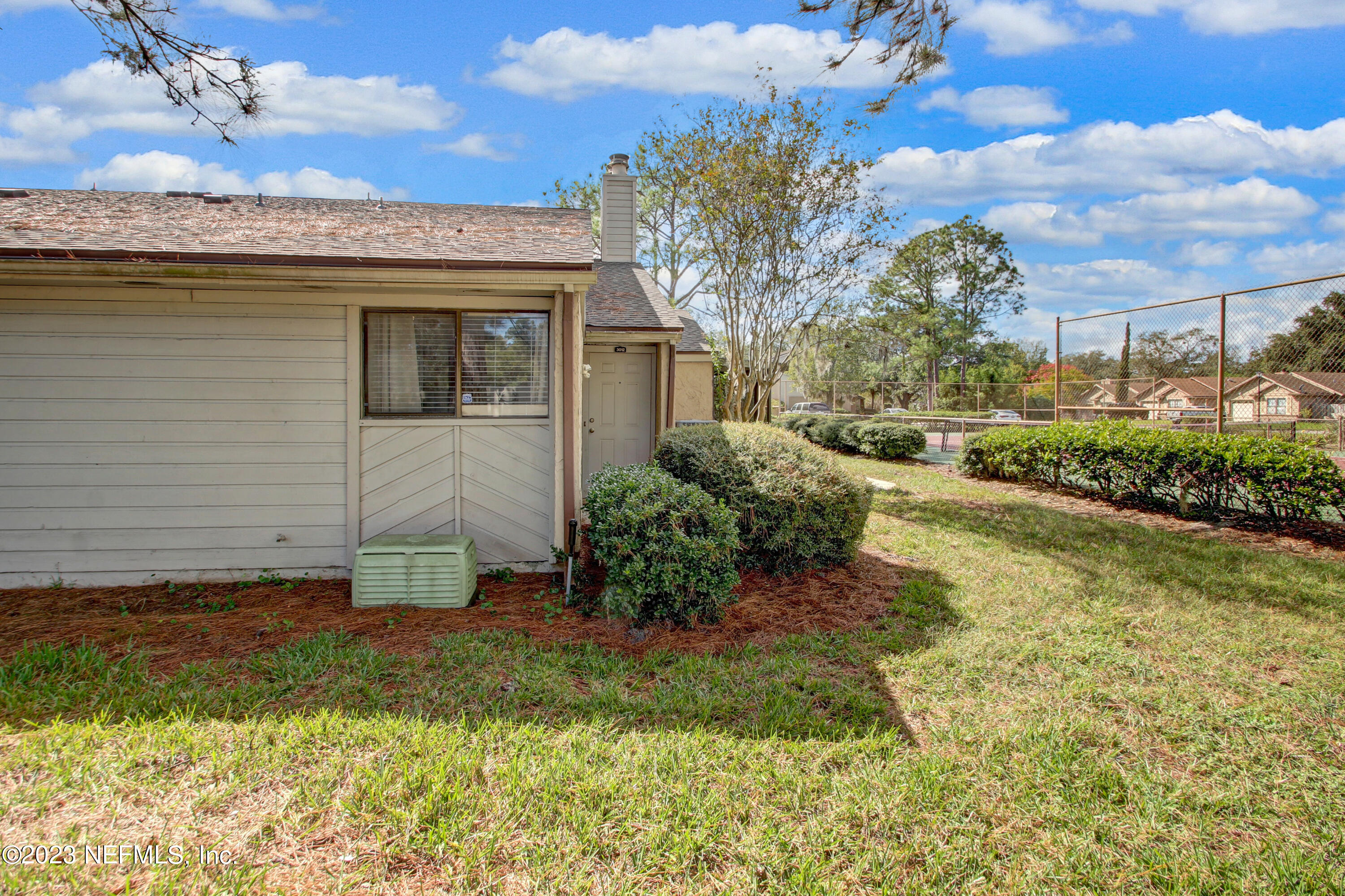 3801 Crown Point Road, Unit 3012 Jacksonville, FL 32257 - Photo 3 of 30 a view of a house with a yard