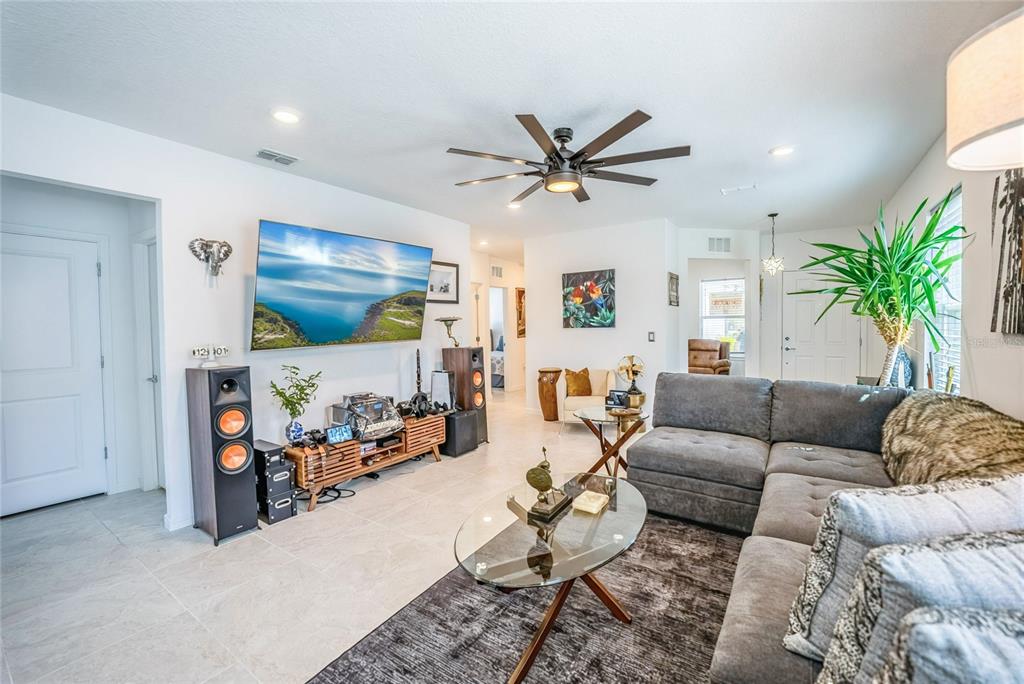8413 Southwest 54th Street Ocala, FL 34481 - Photo 13 of 57 a living room with furniture and a flat screen tv