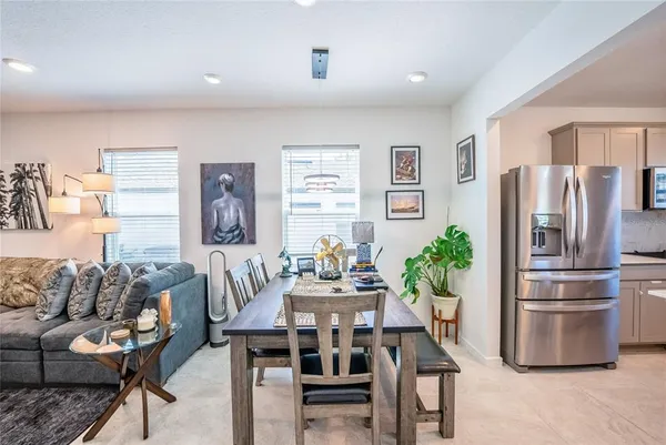 a dining room with furniture and window