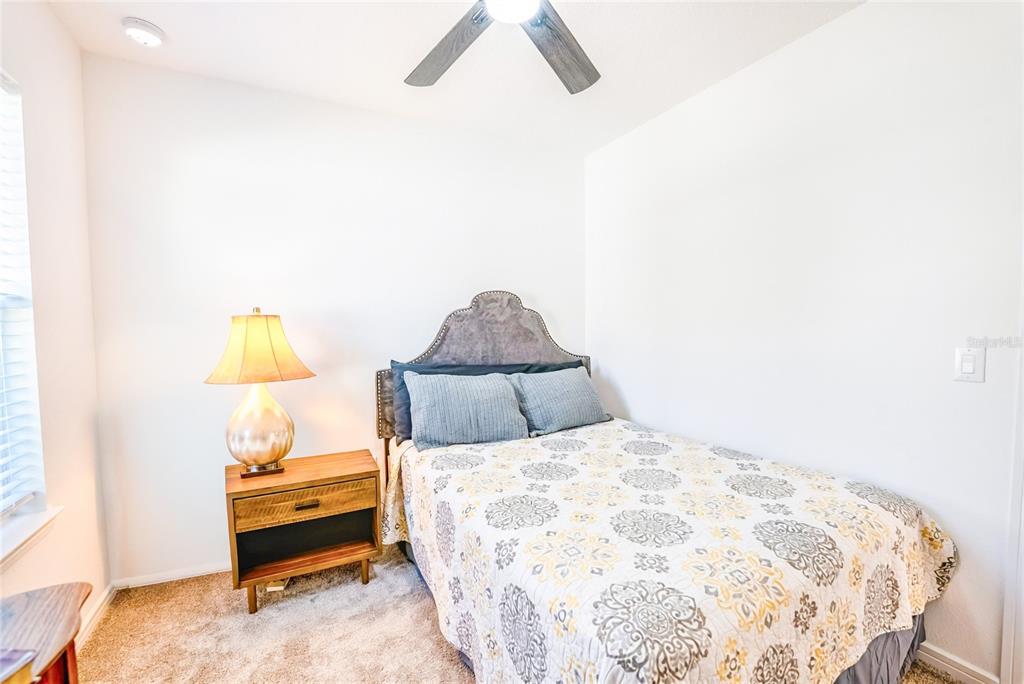8413 Southwest 54th Street Ocala, FL 34481 - Photo 23 of 57 a bedroom with a bed and a window