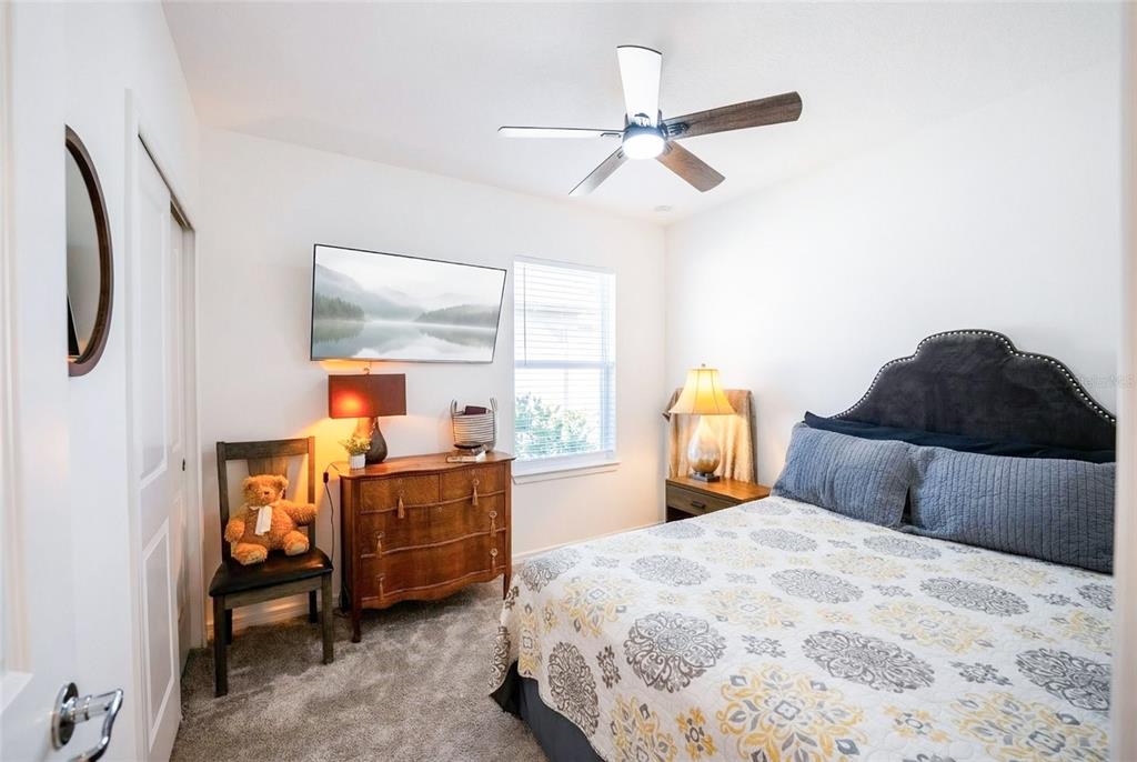 8413 Southwest 54th Street Ocala, FL 34481 - Photo 24 of 57 a bedroom with a bed and a window