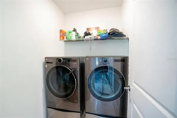 a utility room with dryer and washer