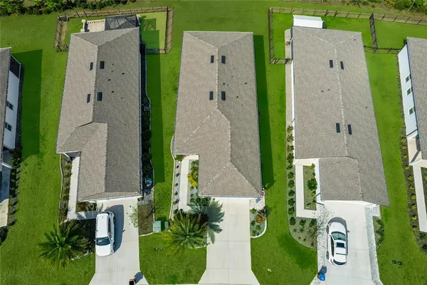 an aerial view of a house with outdoor space swimming pool