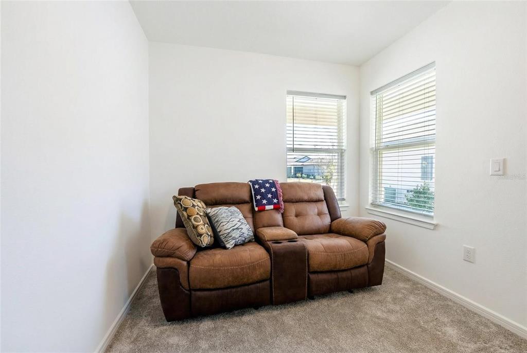 8413 Southwest 54th Street Ocala, FL 34481 - Photo 6 of 57 a living room with furniture and a window