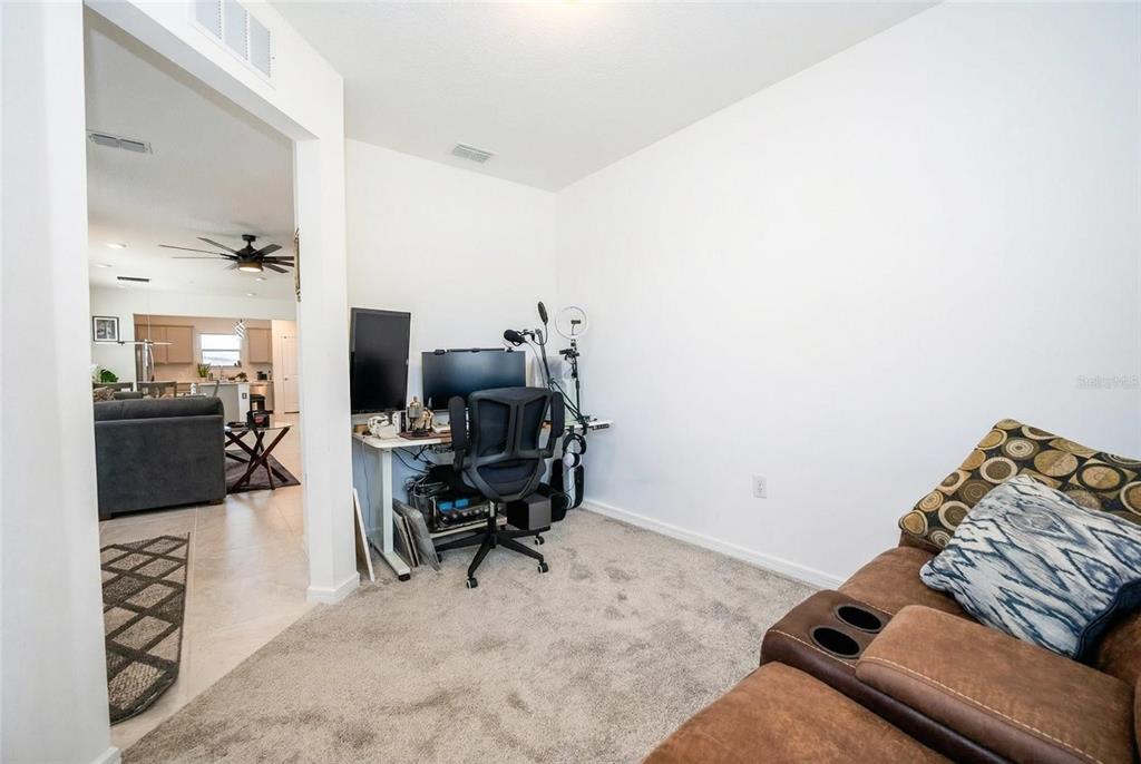 8413 Southwest 54th Street Ocala, FL 34481 - Photo 7 of 57 a living room with furniture and a flat screen tv