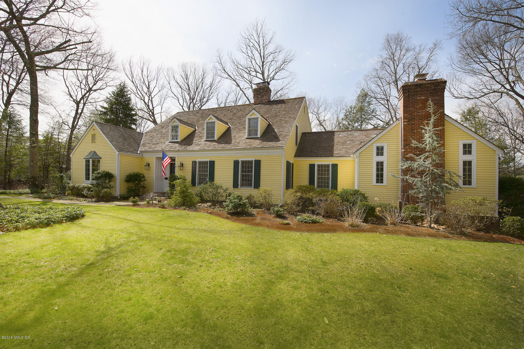 70 North Old Stone Bridge Road Cos Cob, CT 06807 - Photo 1 of 29 a front view of a house with a yard
