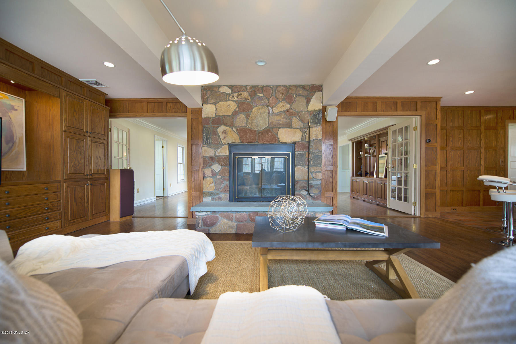 70 North Old Stone Bridge Road Cos Cob, CT 06807 - Photo 12 of 29 a living room with furniture and a chandelier