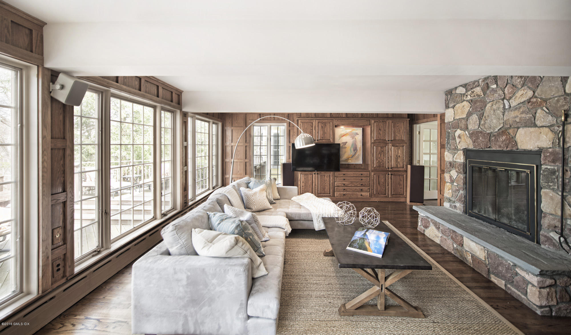 70 North Old Stone Bridge Road Cos Cob, CT 06807 - Photo 13 of 29 a living room with furniture and a floor to ceiling window