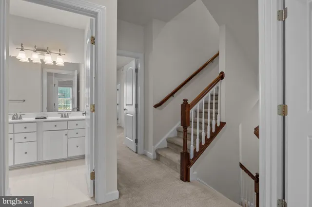 a bathroom with a double vanity sink a mirror and a shower