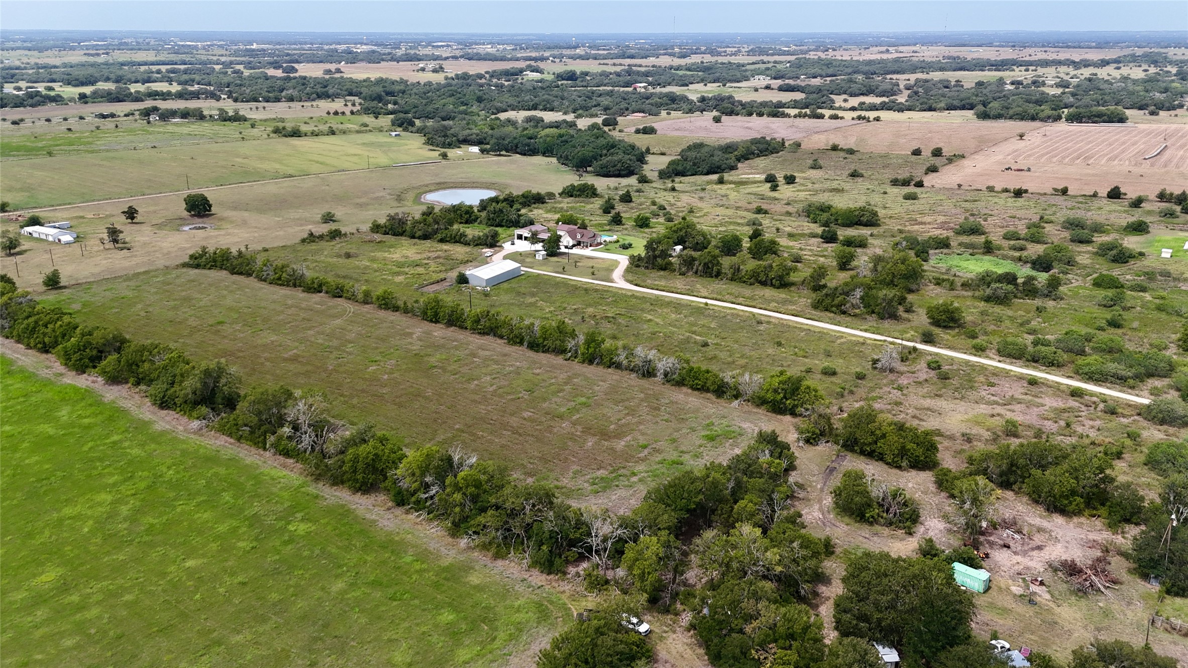 5 Company Field Road Schulenburg, TX 78956 - Photo 13 of 17 an aerial view of a city with mountains