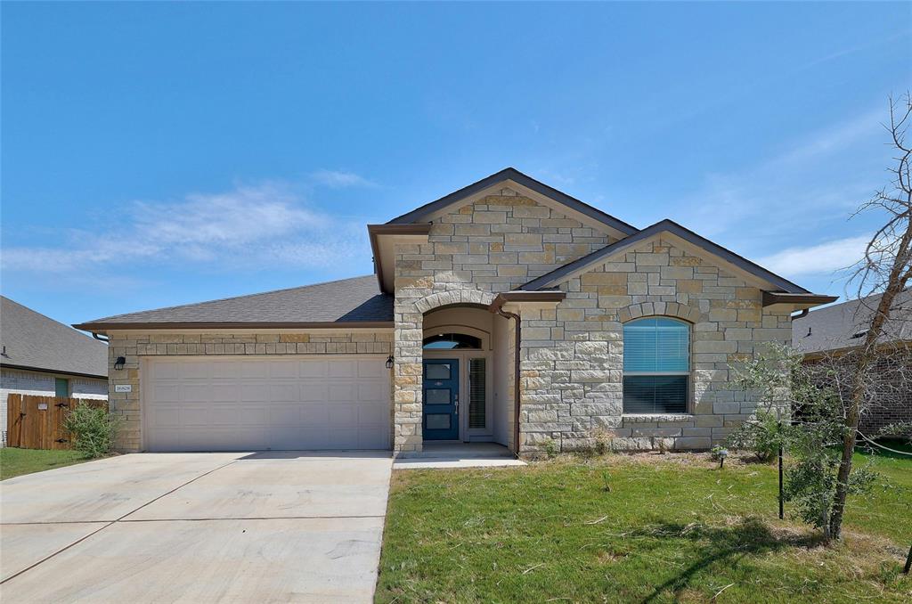 16808 Ponte Cove Pflugerville, TX 78660 - Photo 1 of 1 a front view of a house with a yard and garage