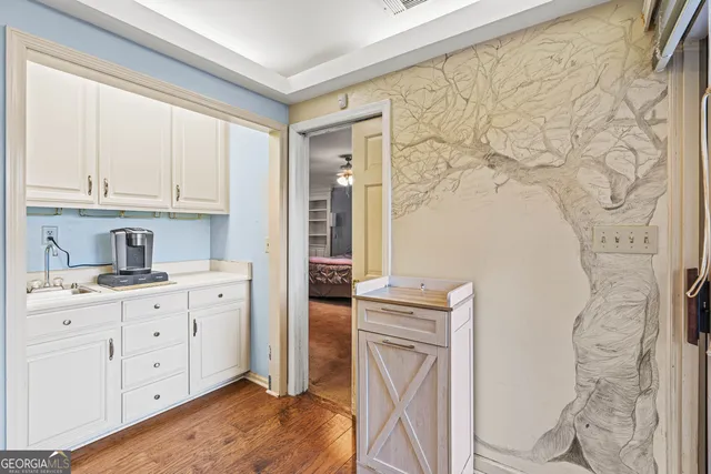 a living room with fireplace furniture and a flat screen tv